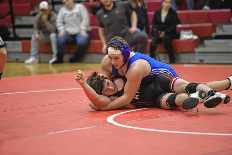 Mohawk Trail’s Will VanVleet attemps to secure a pin against Athol’s Timmy Gerry on Tuesday at Mallet Gymnasium.
