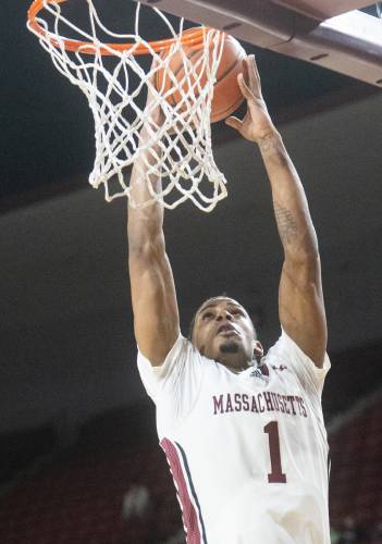 UMass forward Daniel Hankins-Sanford (1) attempts a dunk during the college basketball game against Davidson at the Mullins Center, Wednesday, Feb. 12, 2025, in Amherst.