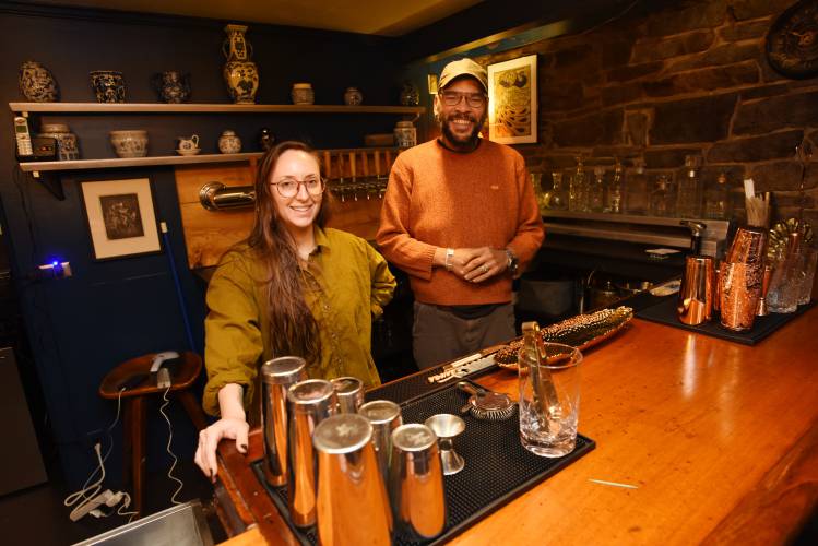 Bar manager Mariel Olcoz and owner Michaelangelo Wescott behind the bar at Le Peacock, a speakeasy-themed bar and eatery that is opening Tuesday, Nov. 21, on Bridge Street in Shelburne Falls.