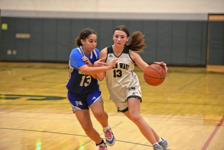 Greenfield’s Tayler Bergeron drives while defended by Narragansett’s Alivia Rolle in a MIAA Div. 5 Round of 32 contest at Nichols Gymnasium on Wednesday.   