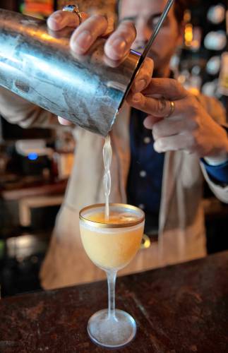Ned King, bar manager of Gigantic in Easthampton, makes a drink called The Gem.