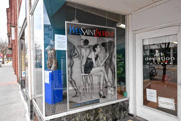 Art in the window of the Art Deviation Gallery & Store on Main Street in Greenfield.