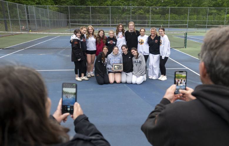 Members of the Belchertown girls tennis team pose for a photograph after winning the PVIAC Class B tournament championship match against Frontier Regional at Belchertown High School, Wednesday, May 21, 2025, in Belchertown.