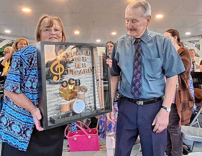 the Orange Community Band ended its summer concert season by honoring longtime drummer Marty Picard with a memory book of photos and a drummer shadowbox created by bandmate Jerry Hageman.