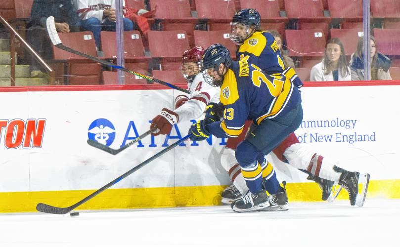 UMass defenseman Kennedy O’Connor (4) skates after the puck during Saturday’s hockey game against Merrimack at the Mullins Center in Amherst.