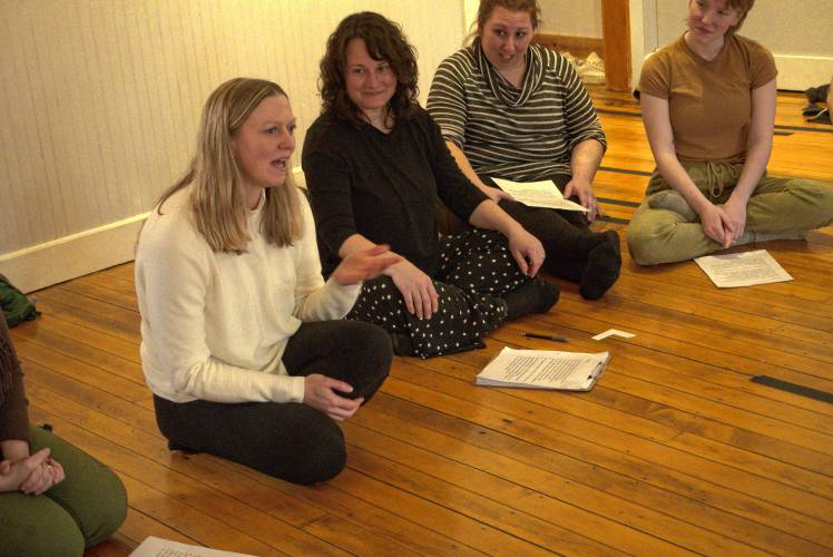 Director Nia Lynn, left, speaks with the cast of Montague Shakespeare Festival's “Macbeth” at a recent rehearsal in Turners Falls. In this “Macbeth,” there are “no swords, no kilts, no furs, there’s no candlelight,” Lynn said. “The point of that is not to be cool and trendy, but to make these characters relatable to people now.”