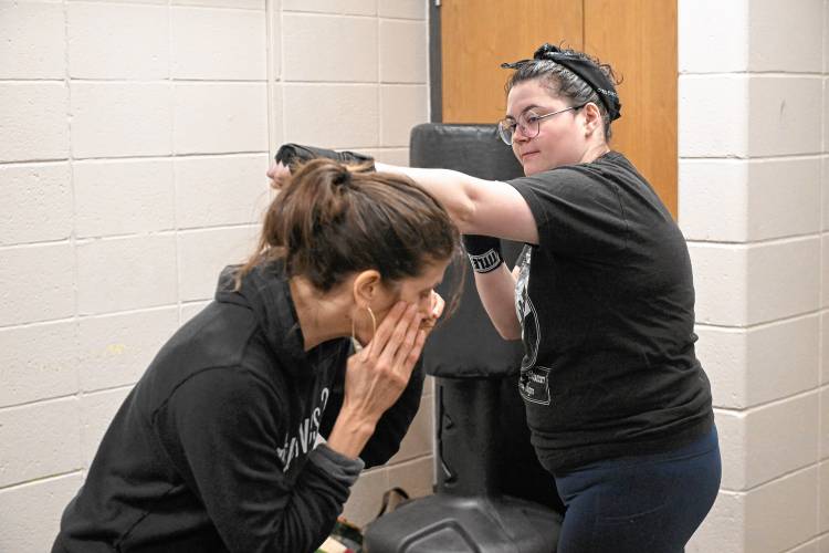 Boxing instructor Vanessa Chakour works with Greenfield Recorder reporter Madison Schofield at Franklin County’s YMCA.