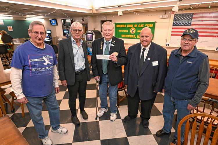 Greenfield Elks Lodge 1296 donated $3,000 to the Building Bridges Veterans Initiative on Thursday. From left are Robert Mott of the Elks, the Rev. Christopher Carlisle of Building Bridges, and Chet Saharceski, Michael Blanchard and Alan Ball of the Elks.