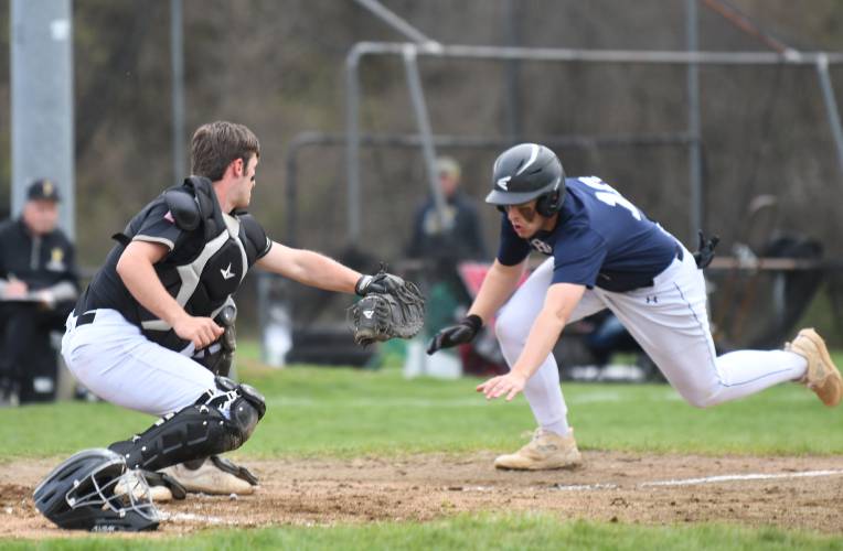 Frontier’s Tyler Cusson tries to avoid the tag at home from Pioneer’s Braeden Tsipenyuk in Northfield last year.  