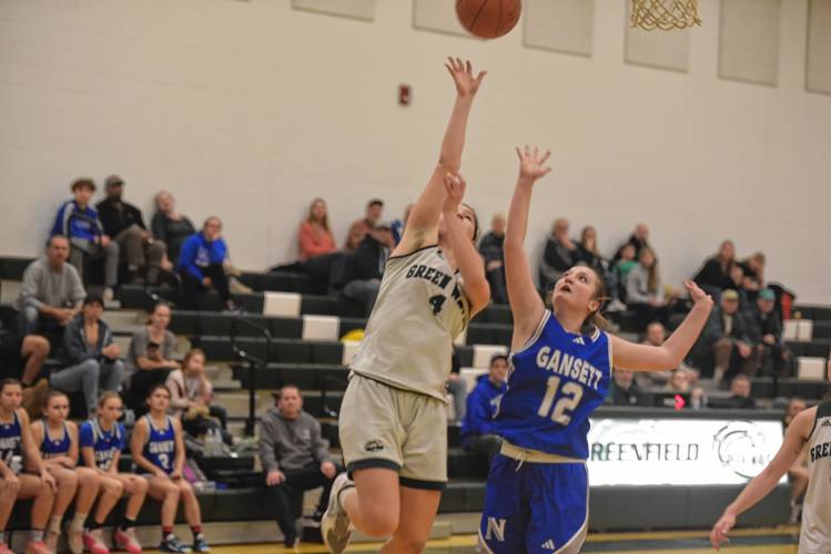 Greenfield’s Carly Blanchard puts up a layup over Narragansett’s Alaina Gallagher in a MIAA Div. 5 Round of 32 contest at Nichols Gymnasium on Wednesday.