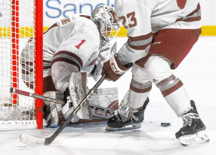 UMass goaltender Jackson Irving (1) tracks the puck during Saturday’s hockey game against Merrimack at the Mullins Center in Amherst.