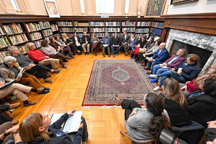 Massachusetts Gov. Maura Healey, at right in blue with beverage cup, meets with local and state officials for a question and answer period at the Field Memorial Library in Conway. Massachusetts Gov. Maura Healey, at right in blue with beverage cup, meets with local and state officials for a question and answer period at the Field Memorial Library in Conway.