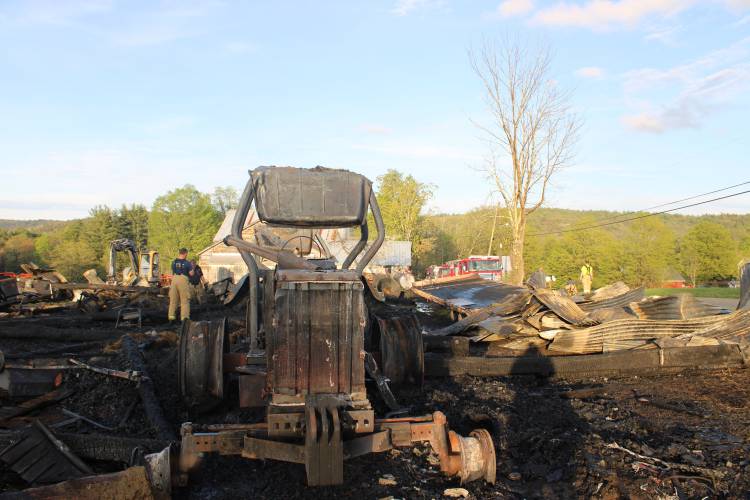 What remains of an Allis-Chalmers tractor belonging to Conway resident Pete Hanas after his barn burned to the ground due to a fire that is suspected to have been started by a lightning strike Saturday afternoon.