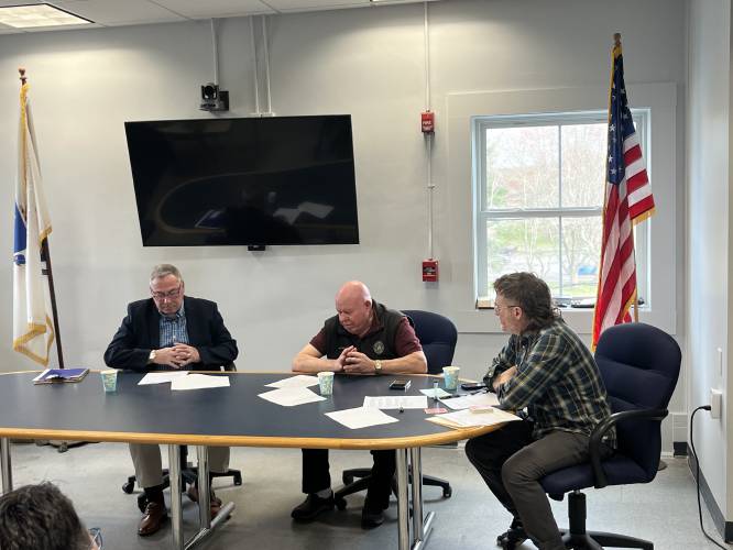 From left, Montague Selectboard candidates Edward Voudren and Christopher Boutwell sit beside Montague Reporter Managing Editor Michael Jackson as they participate in a candidate forum ahead of the Tuesday, May 20, town election.