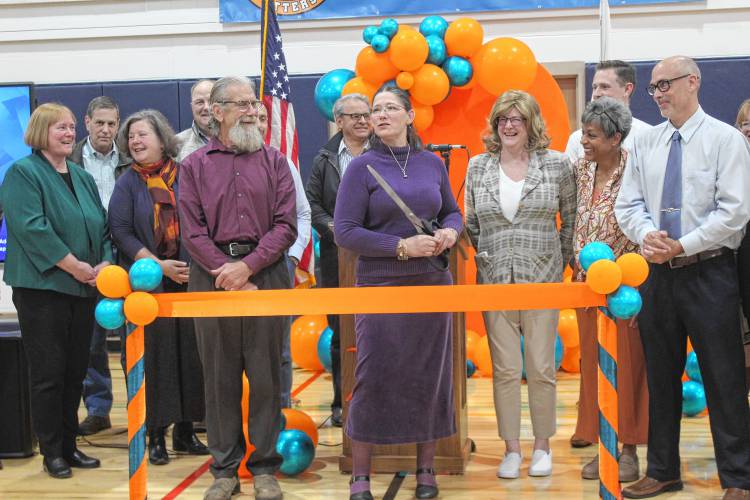 Government officials cut the ribbon to symbolize the opening of the new Fisher Hill Elementary School.