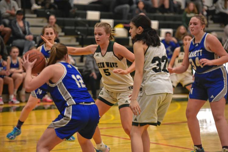 Greenfield’s Gloria McDonald (5) and Niya Strohman (32) trap Narragansett’s Alaina Gallagher in a MIAA Div. 5 Round of 32 contest at Nichols Gymnasium on Wednesday.