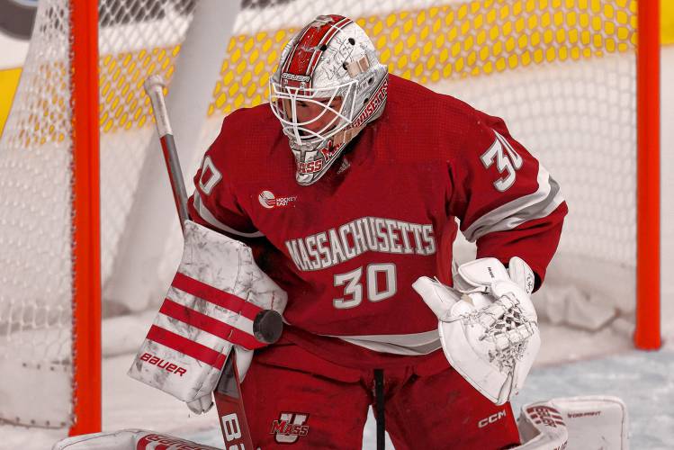 Massachusetts goalie Michael Hrabal (30) stops the puck during the first period of an NCAA hockey game against Bentley on Saturday, Oct. 5, 2024, in Waltham, Mass. (AP Photo/Greg M. Cooper) Massachusetts goalie Michael Hrabal (30) stops the puck during the first period of an NCAA hockey game against Bentley on Saturday, Oct. 5, 2024, in Waltham, Mass. (AP Photo/Greg M. Cooper)