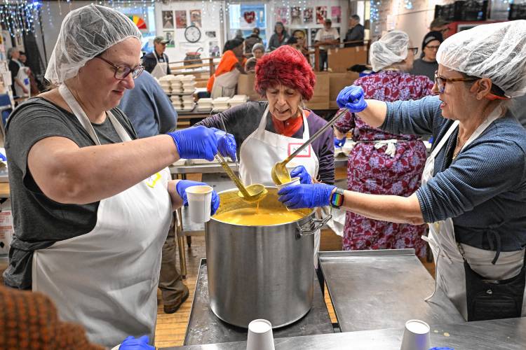 Workers fill cups of soup for a Thanksgiving meals at Stone Soup Café last year in Greenfield. Stone Soup Café was among the local recipients of funding through the Massachusetts Cultural Council’s Festivals & Projects grant program. Workers fill cups of soup for a Thanksgiving meals at Stone Soup Café last year in Greenfield. Stone Soup Café was among the local recipients of funding through the Massachusetts Cultural Council’s Festivals & Projects grant program.