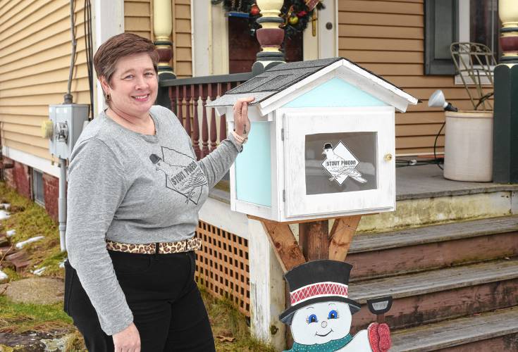 Ericka Almeida of Stout Pigeon Coffee on Maple Street in Turners Falls next to her coffee pick-up box. 