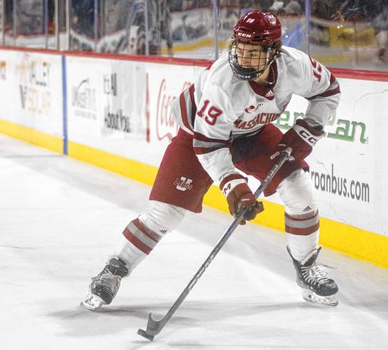 UMass right wing Cole O’Hara (19) controls the puck during Saturday’s hockey game against Merrimack at the Mullins Center in Amherst.