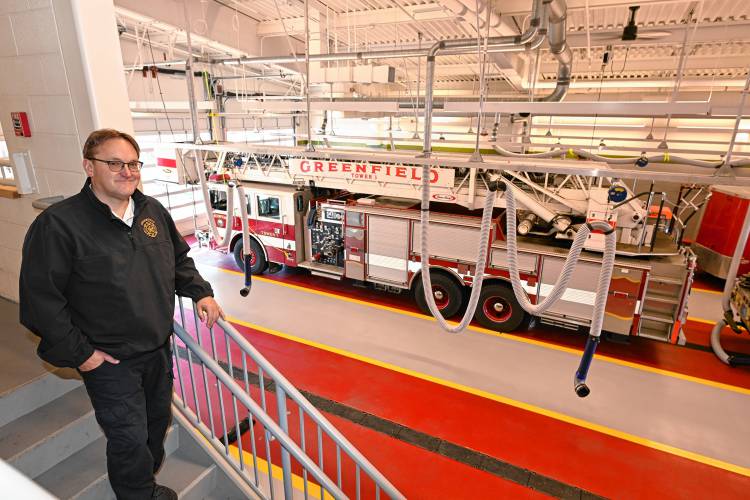 Greenfield Fire Chief Robert Strahan with the Tower 1 ladder truck at the Greenfield Fire Station.