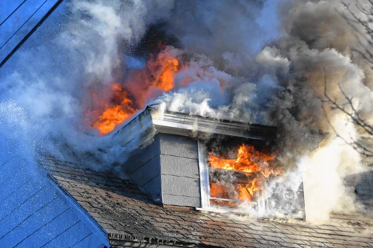 A stubborn blaze in frigid temperatures kept firefighters busy at this apartment house fire early Sunday morning at 75 School St. in Greenfield.
