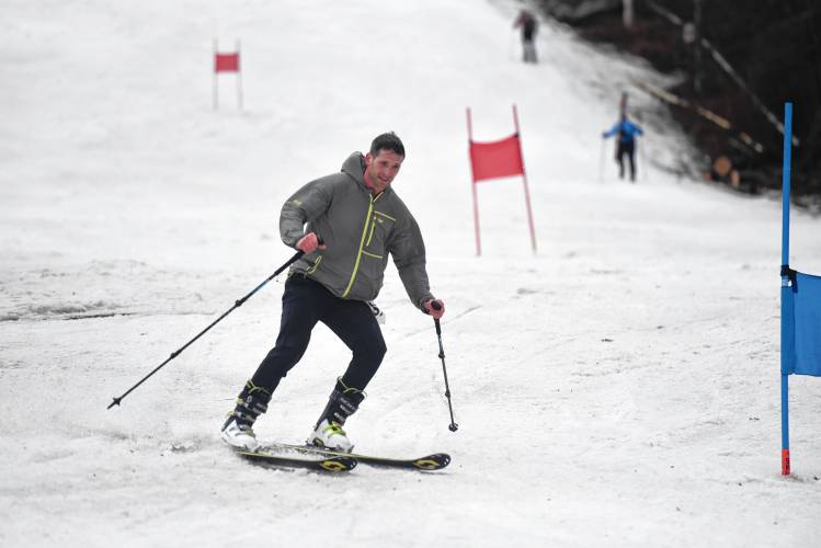 A member of Team Windsor Mountain Dad Dashers makes their way down the mountain during the ski portion of the Berkshire Highlands Pentathlon on Saturday at Berkshire East. 