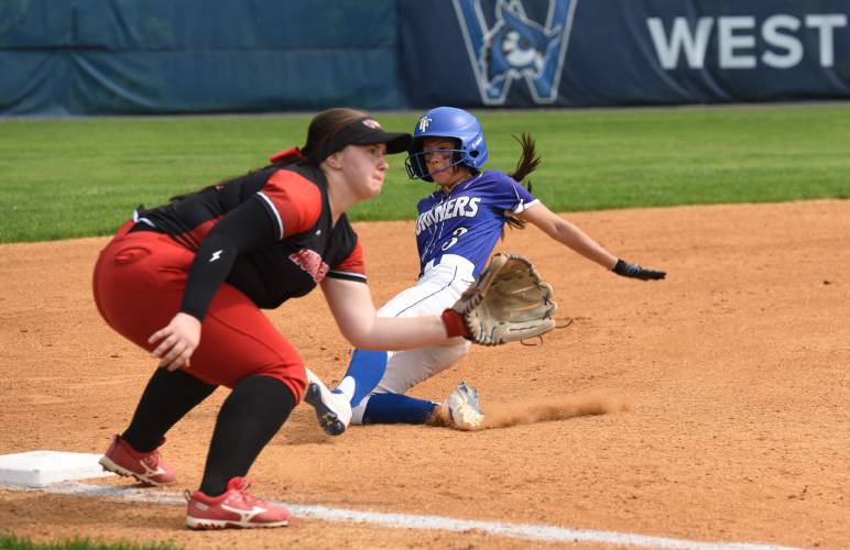Turners Falls’ McKenzie Stafford slides safely into third base during the Thunder’s 12-1 win over Hoosac Valley in the Western Mass. Class D final on Wednesday at Westfield State University.