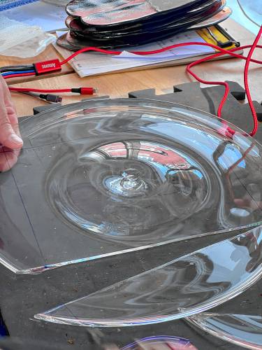 The first of four cuts to form a rectangular pane of glass for the transom windows at the Buckland Historical Society’s Wilder Homestead.