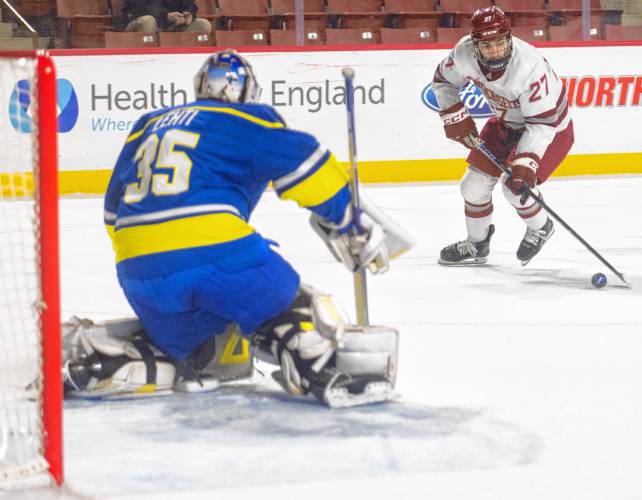 UMass left wing Michael Cameron (27) skates toward the net during the NCAA hockey game against Alaska at the Mullins Center, Friday, Jan. 24, 2025, in Amherst.
