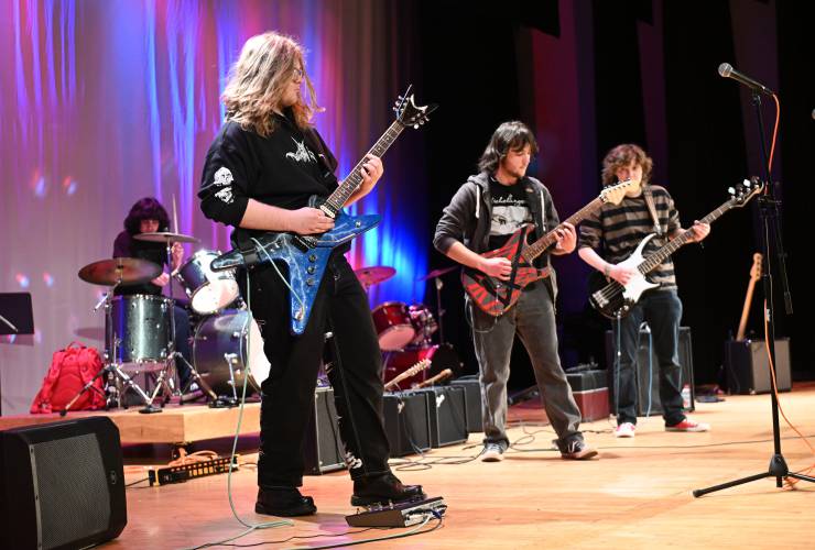 Turners Falls High School Rock Club members play an Iron Maiden song at Frontier Regional School for students in the auditorium last week.