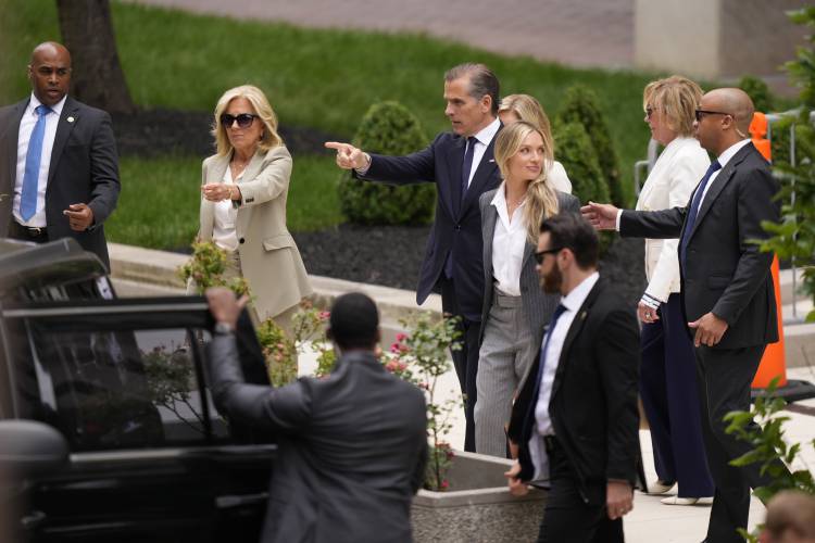 Hunter Biden, President Joe Biden's son, accompanied by his mother, first lady Jill Biden and his wife, Melissa Cohen Biden, walks out of federal court after hearing the verdict, Tuesday, June 11, 2024, in Wilmington, Del. Hunter Biden has been convicted of all 3 felony charges in the federal gun trial. (AP Photo/Matt Slocum)