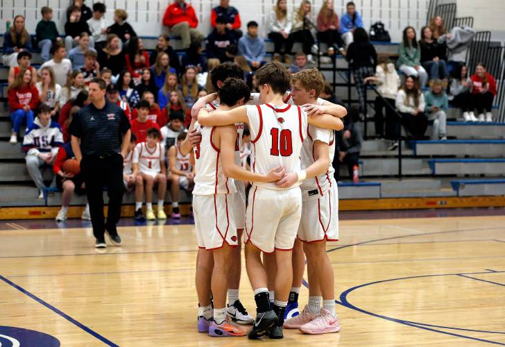 Frontie players huddle up before their game against Drury on Friday night at Goodnow Gymnasium in South Deerfield.