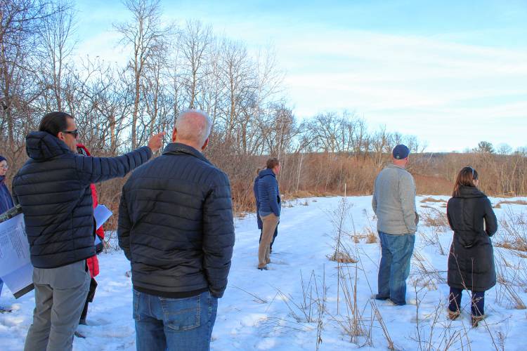 Berkshire Design Group Landscape Architect Carlos Nieto points as he leads Deerfield Planning Board and Zoning Board of Appeals members on a site visit of the Friends of the Franklin County Sheriff’s Office Regional Dog Shelter’s potential new building site on Plain Road East.