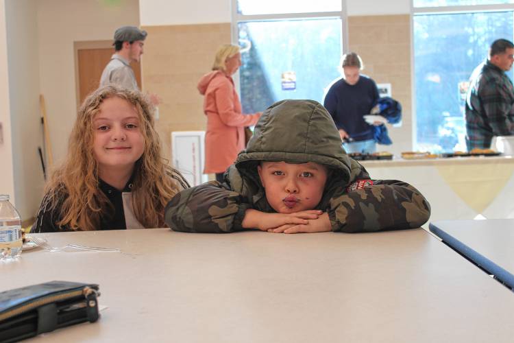 Angelique Connolly, 10, and Maverick Lawton, 10, attend Saturday’s ribbon-cutting ceremony for Fisher Hill Elementary School.