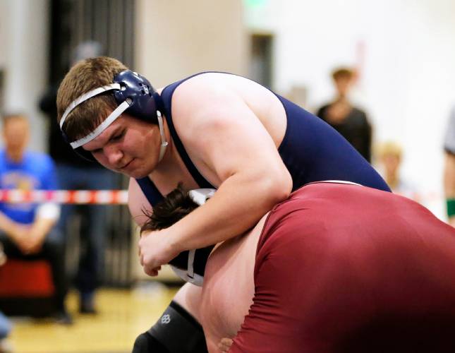 Franklin Tech’s Dillon Laffond competes to a second place finish against Monument Mountain’s Sam St. Peter in the 285-pound final Saturday during the MIAA Division 3 Western Mass wrestling championships at Mount Greylock Regional School in Williamstown. 
