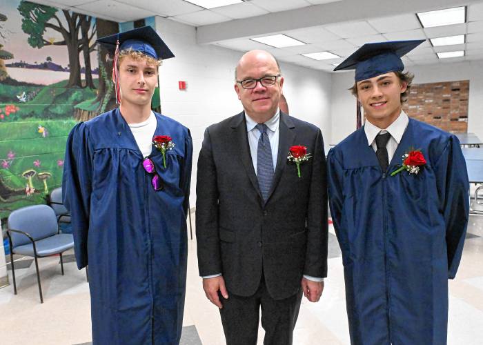 Frontier Seniors Aiden Dredge and Nicholas Fasulo flank U.S> Rep Jim McGovern who spoke at Frontier Regional School graduation on Friday Night in South Deerfield.