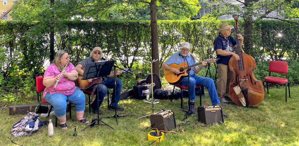 The Falltown String Band performs during an ice cream social held in honor of late historian Peter Miller at the Historical Society of Greenfield on Saturday.