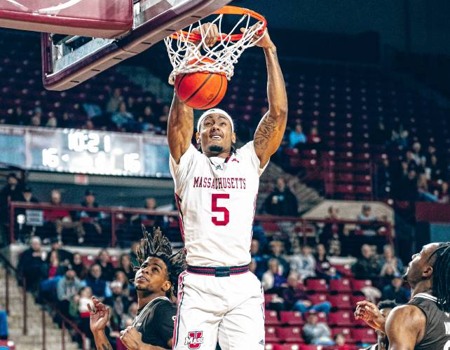UMass senior forward Daniel Rivera (5) throws down a two-handed dunk during the Minutemen’s 73-59 loss to St. Bonaventure on Saturday afternoon at Mullins Center.