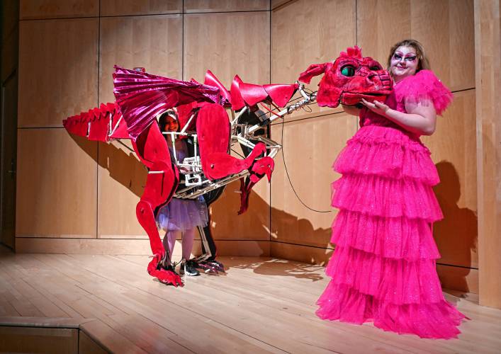 Athena Willor operates the dragon while Lia Little provides the voice of the dragon during Turners Falls High School and Great Falls Middle School’s production of “Shrek the Musical.”