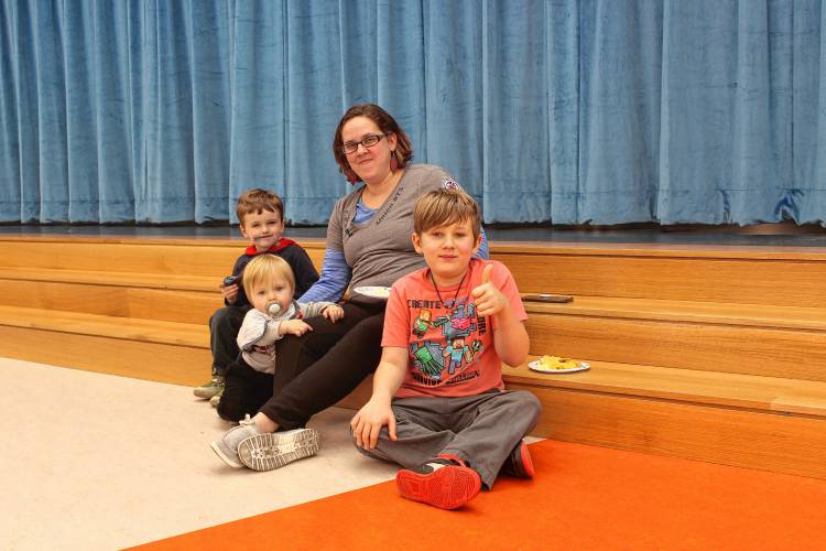 Mallory Ellis with her children Julian, 4, Maverick, 10 months, and Liam, 10, at Saturday’s ribbon-cutting ceremony at Fisher Hill Elementary School.