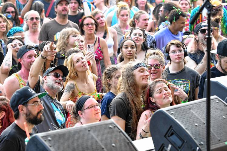 Faces in the crowd watch Badfish perform on the Main Stage at the 20th StrangeCreek Campout at Camp Kee-wanee in Greenfield on Saturday.