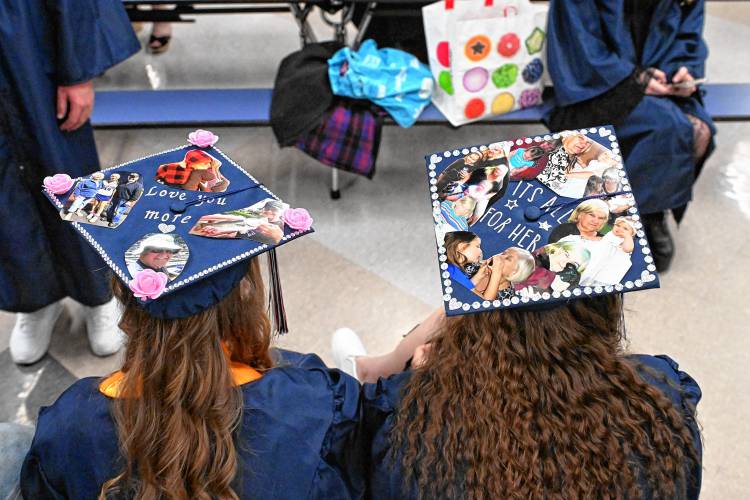 Frontier Seniors Madison McKemmie and Hailey Hutkoski pay tribute to their grandparents on their mortar boards to Frontier Regional School graduation on Friday Night in South Deerfield.