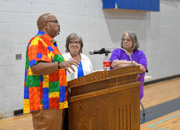 Franklin County Technical School programming and web development instructors Marcus McLaurin, left, and Cyndi Bussey, right, flank Gill-Montague Senior Center volunteer Colleen Doherty on Thursday as she donates an Oculus 3 viewing device to the school as thanks for the students helping Senior Center members with technical questions about their electronic devices. Franklin Tech students have been going to the center on Tech Tuesdays to help seniors with their cellphones, tablets, laptops and any other technical questions they might have. They have helped more than 70 people retrieve lost photos, revive dead computers and fill out forms online for services. The gift was paid for by the Friends of the Gill-Montague Senior Center. 