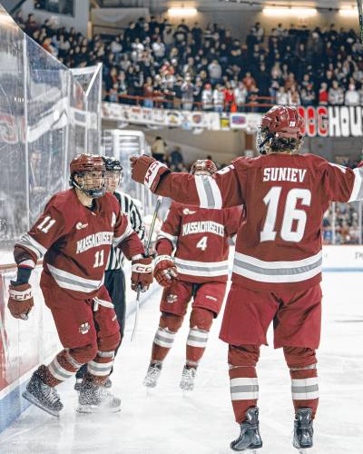UMass’ Lucas Mercuri (11) and Aydar Suniev (16) celebrate after a goal during the Minutemen’s 5-0 win over Northeastern on Friday night.