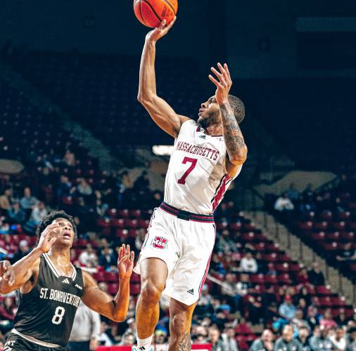 UMass senior guard Rahsool Diggins (7) puts up a floater over St. Bonaventure’s Jonah Hinton (8) during the Minutemen’s 73-59 loss to the Bonnies on Saturday afternoon at Mullins Center.