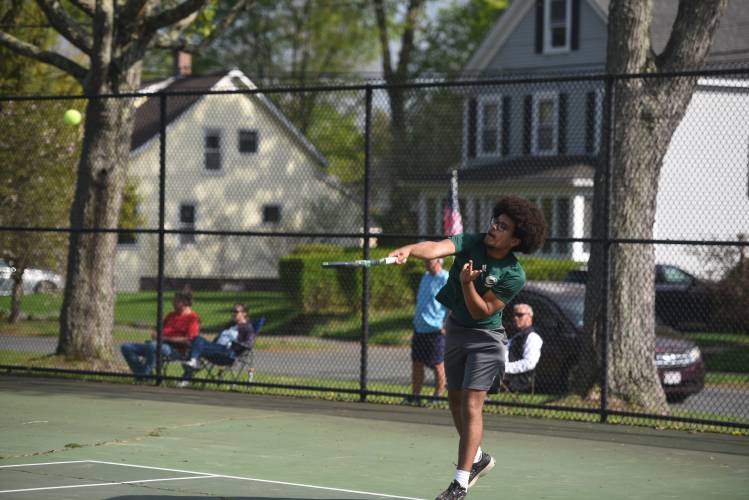 Greenfield's Devonne Brown serves in No. 3 singles against Frontier at the Davis Street Courts Friday. 