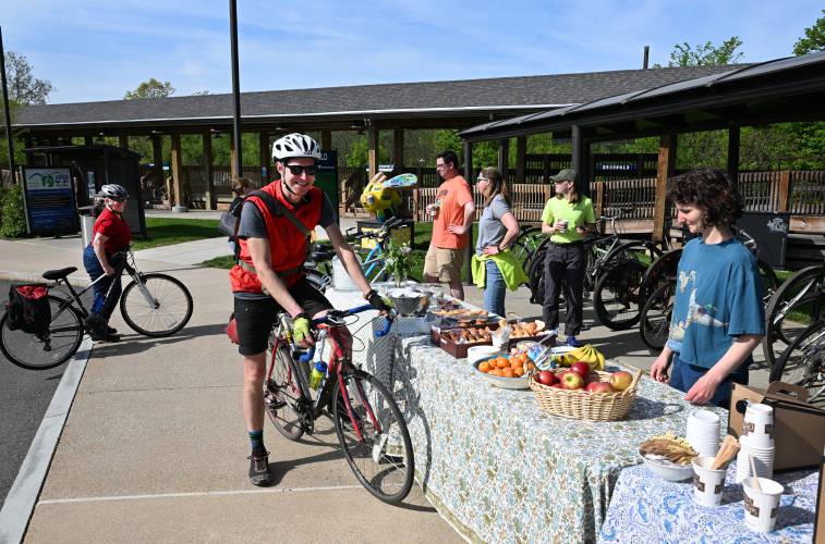 Garth Shaneyfelt of Greenfield, on bike, talks with Sara Brown, right, of Greenfield at the Franklin Regional Council of Governments’ 2025 Franklin County Bike Breakfast on Tuesday morning in partnership with Baystate Health. The free breakfast was a networking and brainstorming event for local cyclists to meet each other and share ideas on how to improve biking in the county. Garth Shaneyfelt of Greenfield, on bike, talks with Sara Brown, right, of Greenfield at the Franklin Regional Council of Governments’ 2025 Franklin County Bike Breakfast on Tuesday morning in partnership with Baystate Health. The free breakfast was a networking and brainstorming event for local cyclists to meet each other and share ideas on how to improve biking in the county.