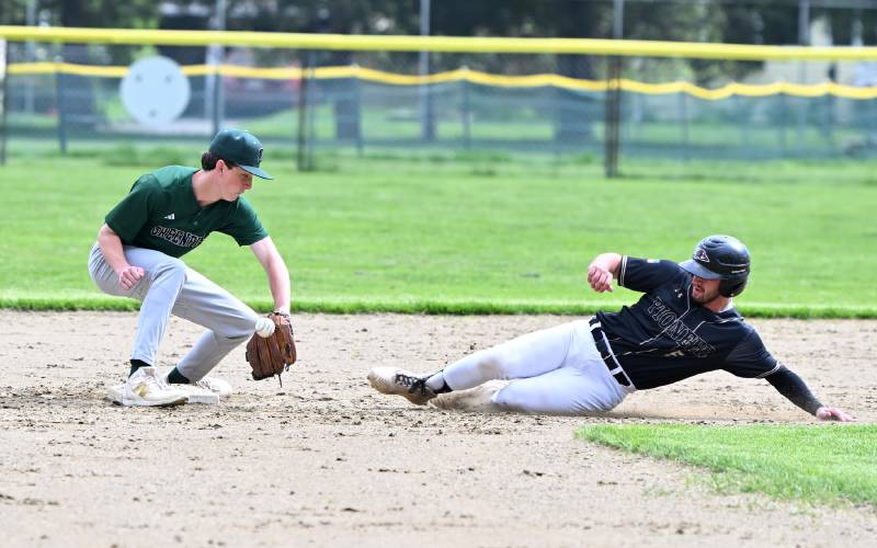 Greenfield’s Conner Bergeron mishandles the throw as Pioneer’s Braeden Tsipenyuk slides into second at Vets Field Wednesday.
