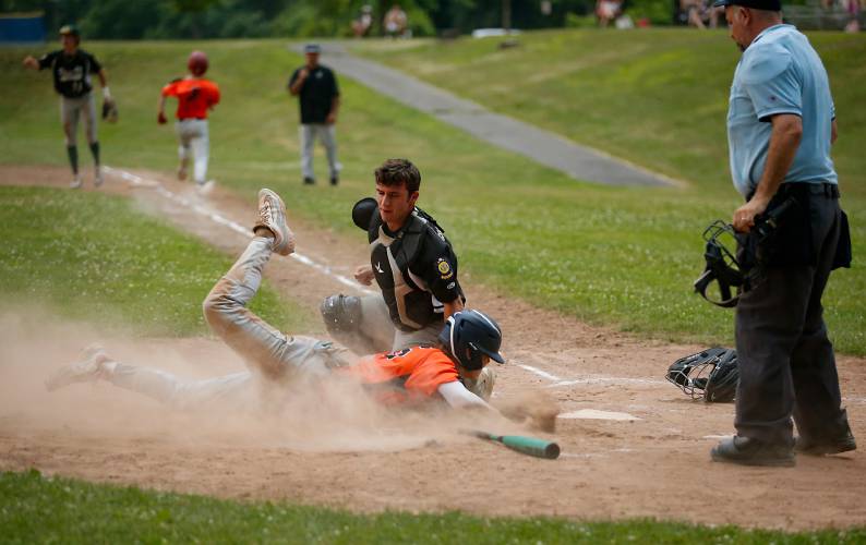 Greenfield Post 81 catcher Braeden Tsipenyuk (5) tags out Belchertown Post 239 baserunner Chace Earle (25) on a play at home plate last season in Belchertown.